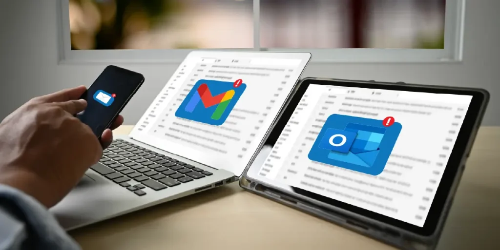 gmail vs outlook for business - two screens with each logo of the companies and a cell phone with an email logo